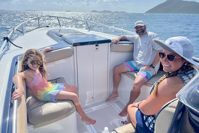 Catamaran sailing through the British Virgin Islands on a Road Town island hopping snorkeling cruise in Tortola BVI with drinks on deck